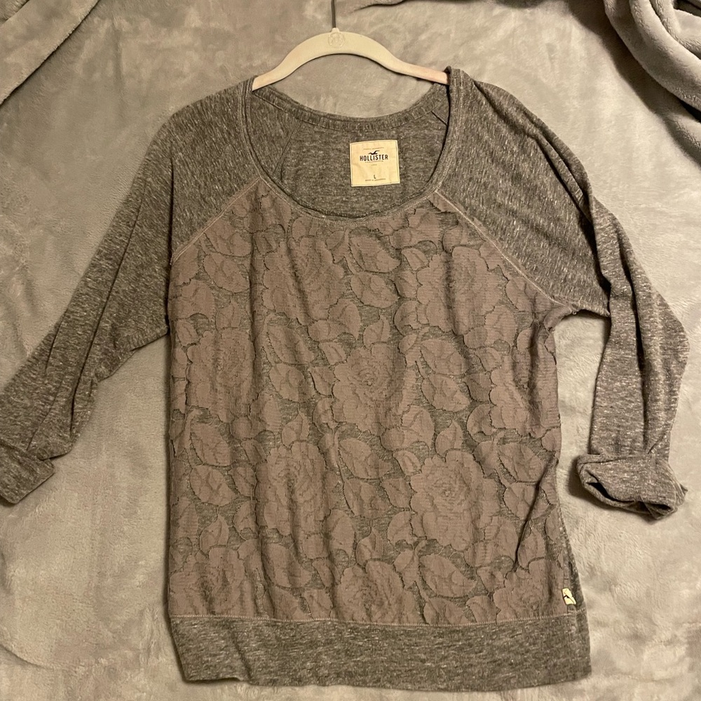 5/$25 Hollister quarter length grey shirt with lace design on front.